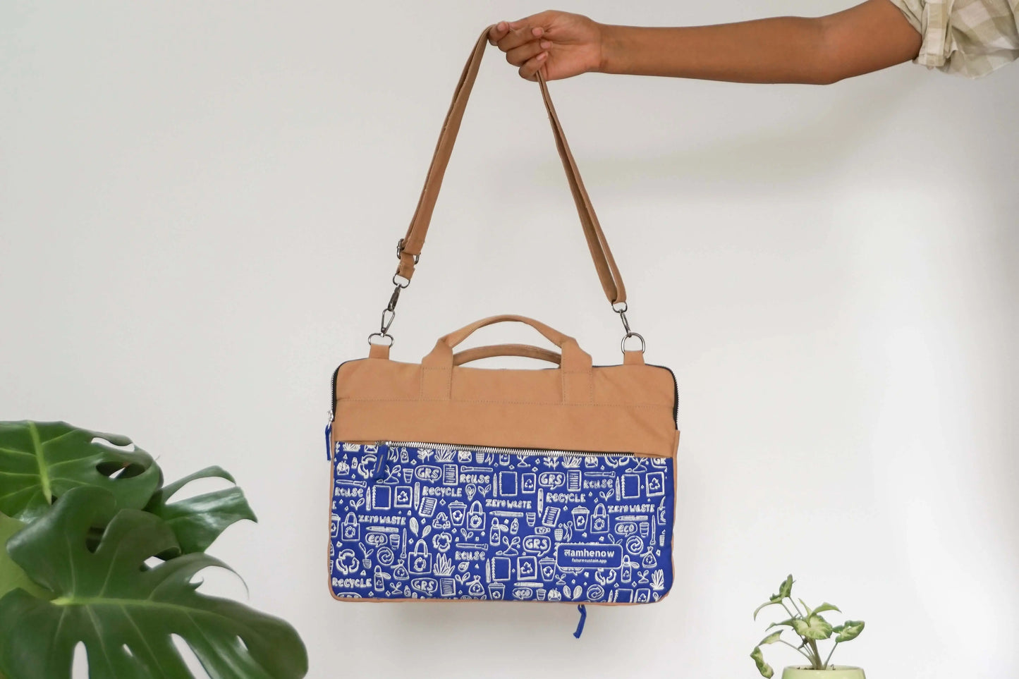 Eco-friendly canvas laptop sleeve with tan handle, affordable and sustainable