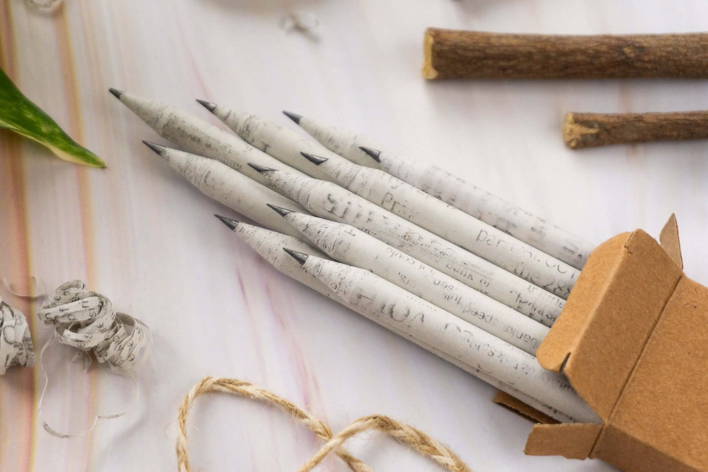 Sustainable newspaper pencils, close-up of recycled material