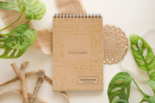 Affordable eco-friendly pocket planner with brown kraft cover and plant