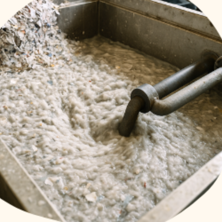 Paper pulp being blended in a vat