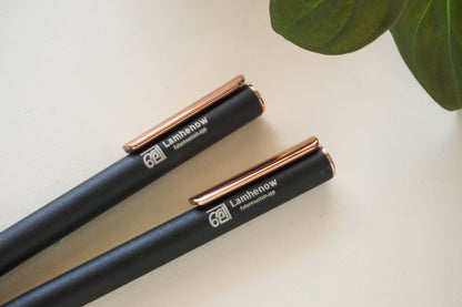 Eco-friendly metal clickable pens on white background